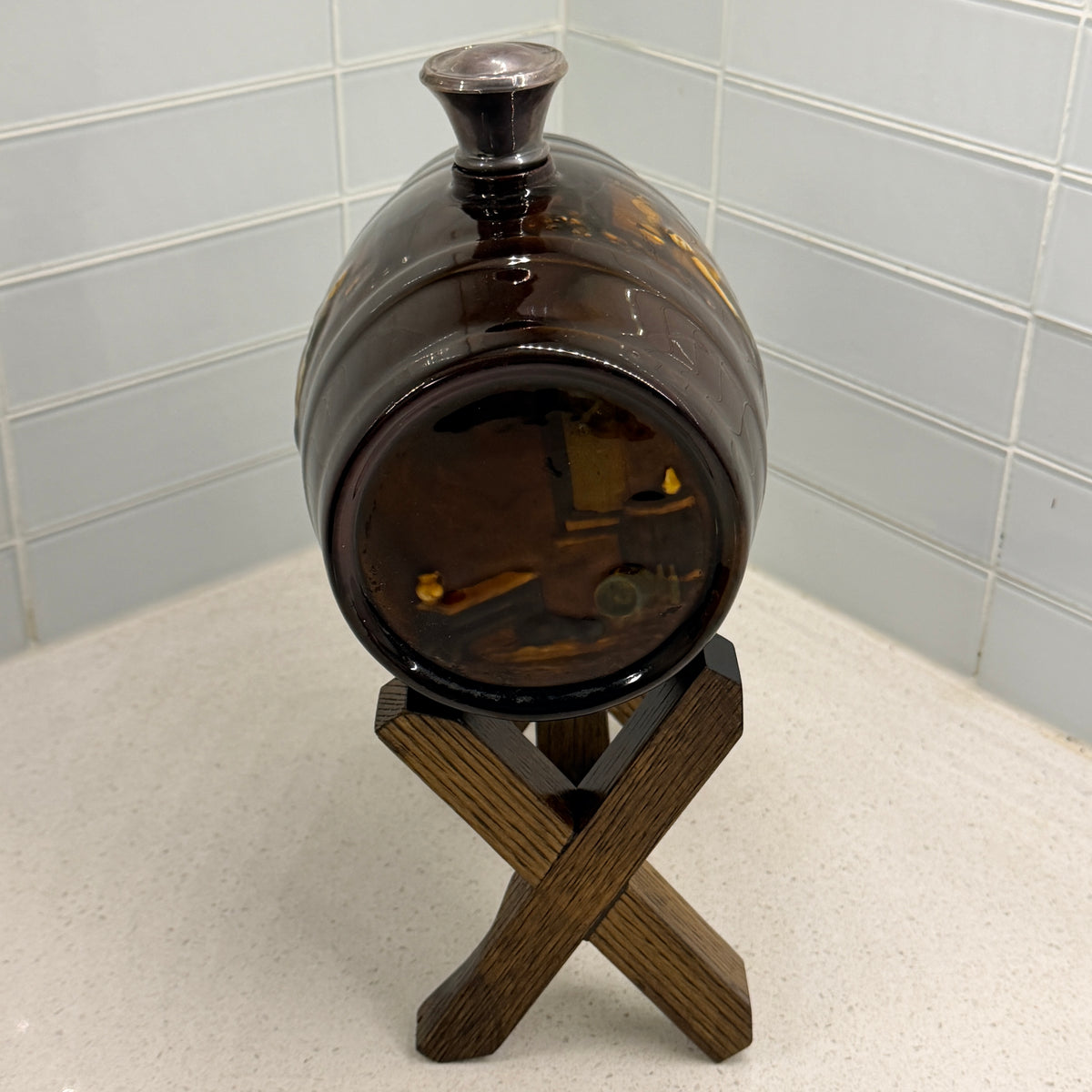 Royal Doulton Kingsware spirit barrel, end view showing cellar interior scene
