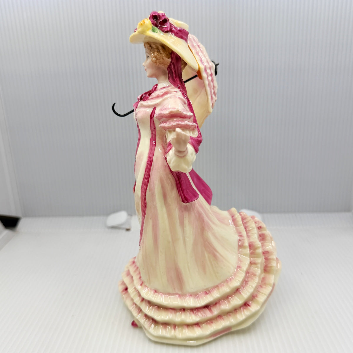 Royal Doulton figurine Springtime HN3477 by Valerie Annand, an 8 inch hand-painted bone china lady figure from the Seasons series