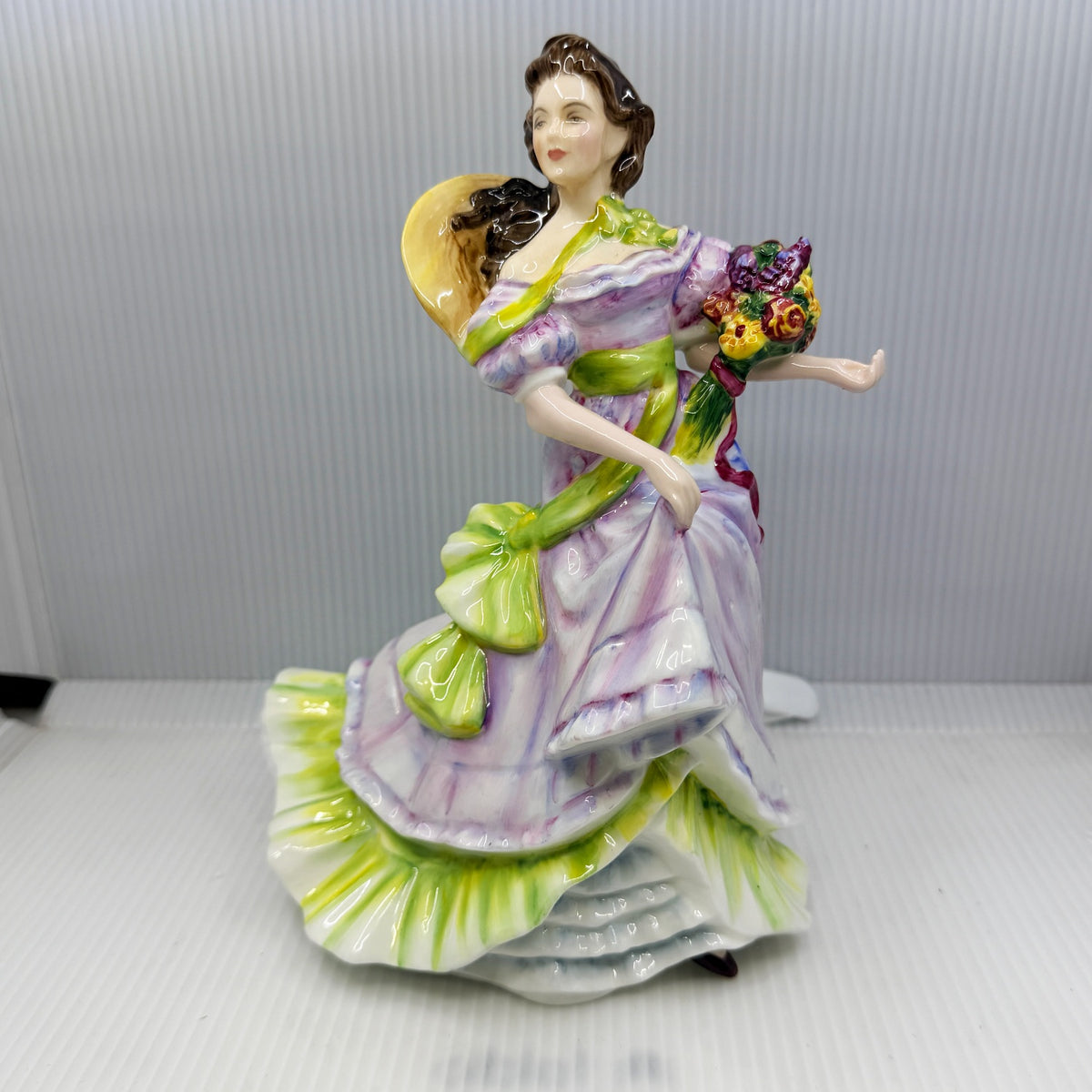 Royal Doulton figurine Summertime HN3478 by Valerie Annand, an 8.5 inch hand-painted bone china lady figure from the Seasons series