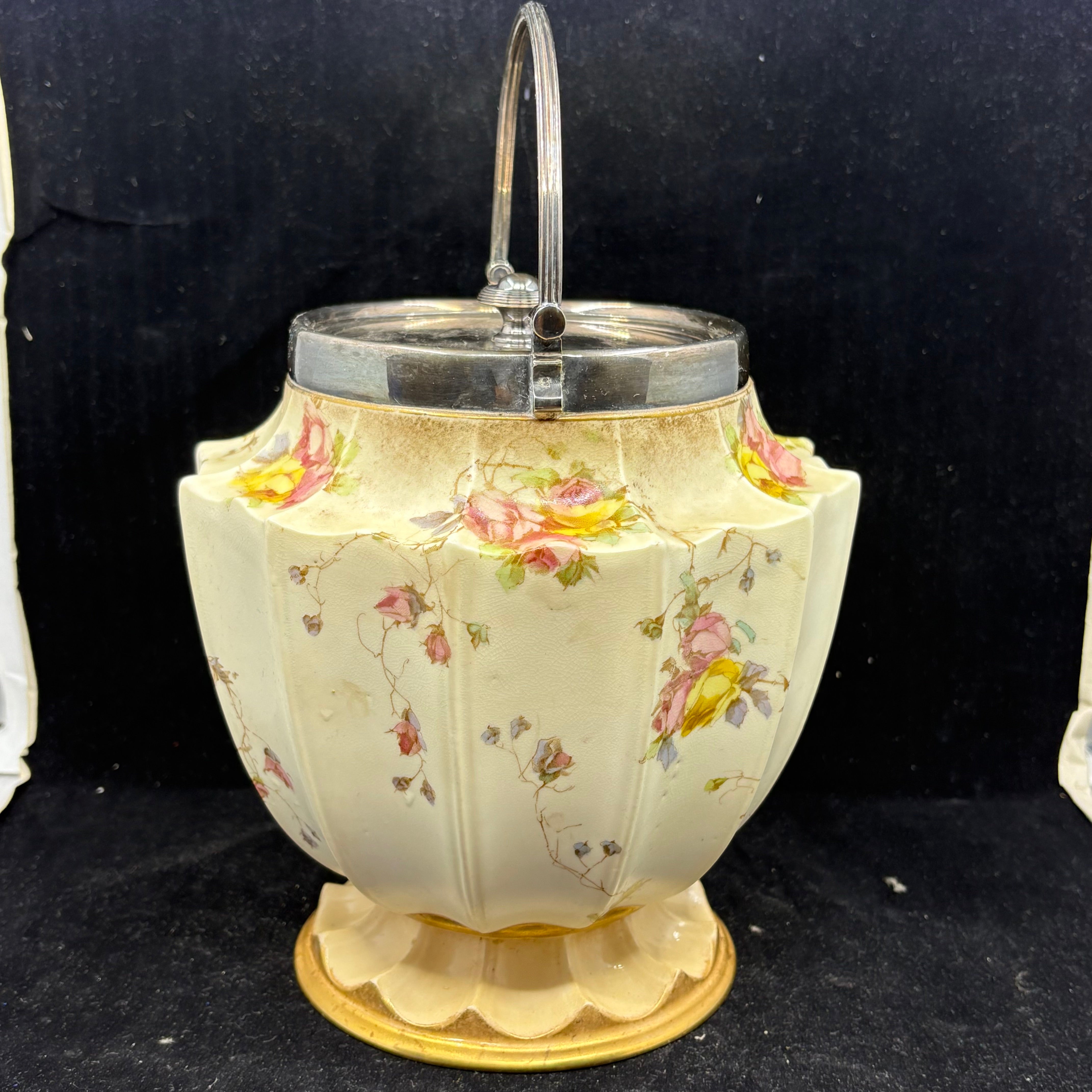 Hand-painted floral decoration detail on Doulton Burslem biscuit barrel cream ground