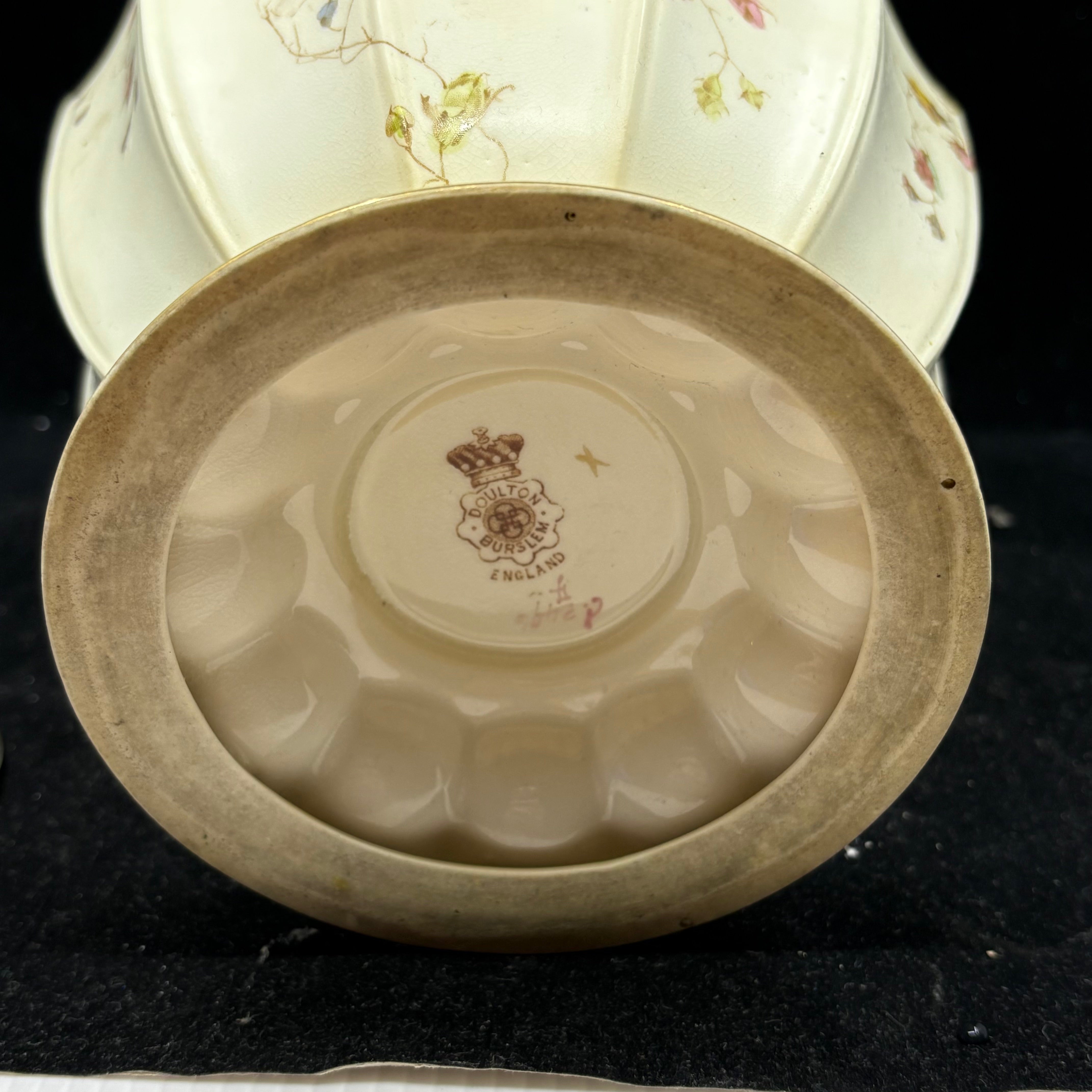 Hand-painted floral decoration detail on Doulton Burslem biscuit barrel cream ground"