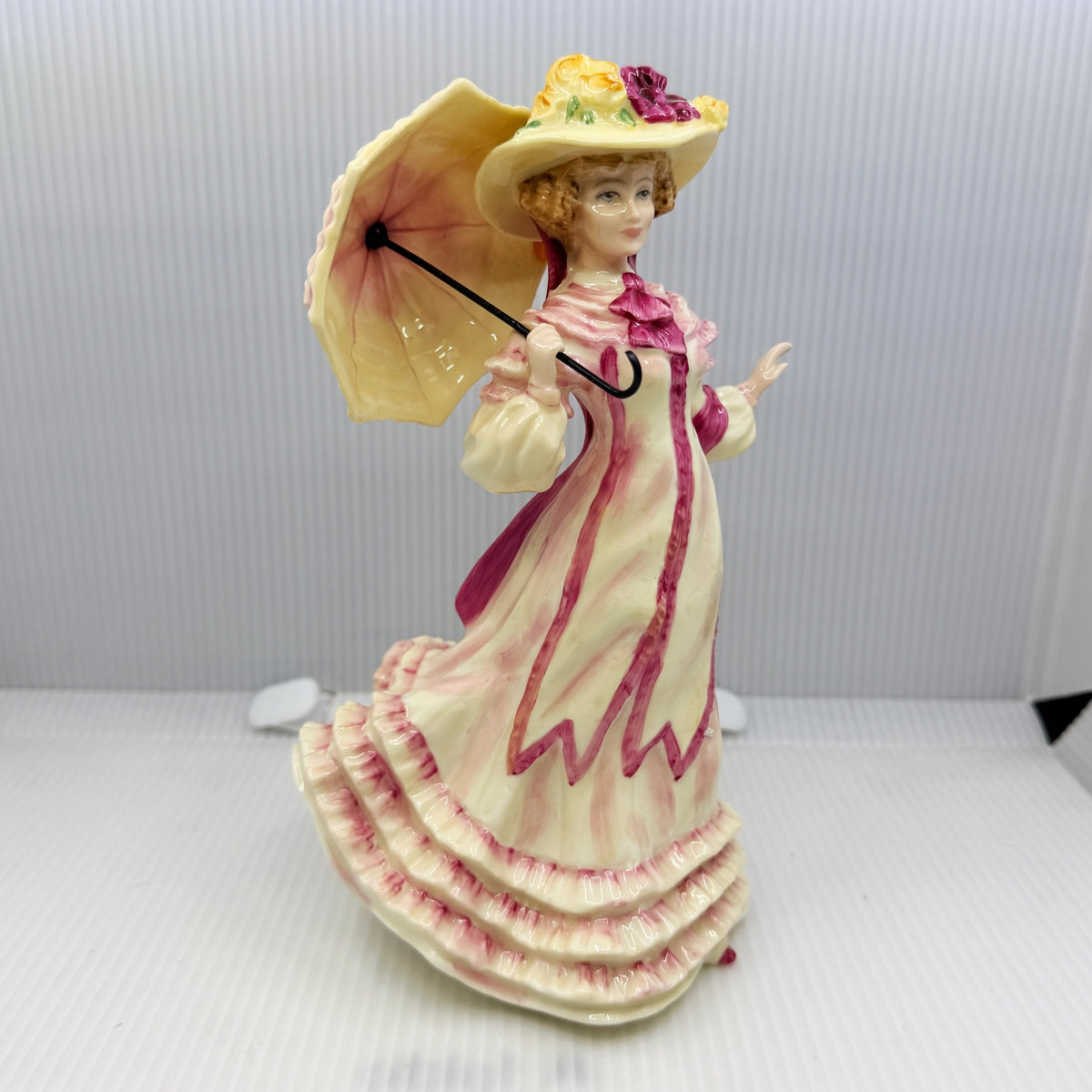 Royal Doulton figurine Springtime HN3477 by Valerie Annand, an 8 inch hand-painted bone china lady figure from the Seasons series